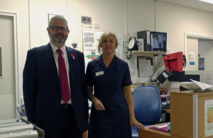 Adrian Masters with a member of staff at South Warwickshire NHS Foundation Trust.