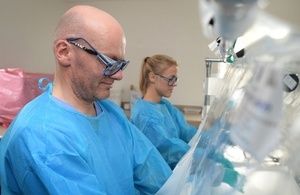 Scientists test lab samples at laboratory