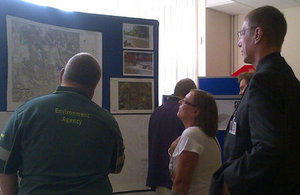 Environment Agency staff talking to community members