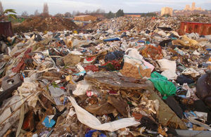 Piles of rotting waste with Lincoln Cathedral in the distance