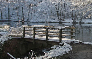 Image of snow scene of foot bridge near the pools at Birches valley visiting centre. Cannock Chase. Rugeley. Staffordshire.