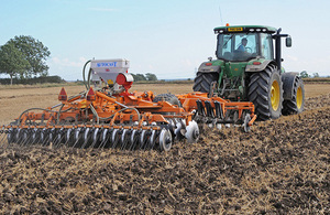 Tractor cultivating soil