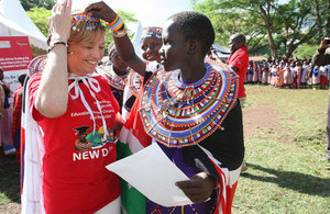 Head of DFID Kenya Lisa Phillips and one of the young girls