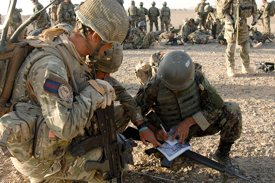A Royal Ghurkha Rifles officer mentoring his Afghan counterpart 