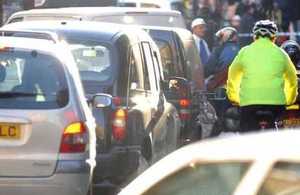 Cyclist negotiating city traffic