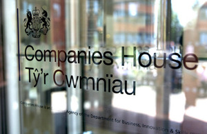 Photograph of Companies House logo on glass door