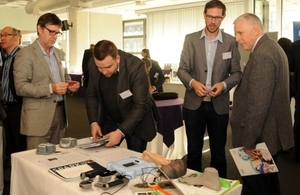 A picture of delegates looking at the 3D scanning system developed by Fuel 3D