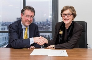 Jim Crawford and Dame Carol Black signing the responsibility deal