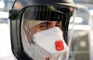 Photograph of a medic in a protective suit