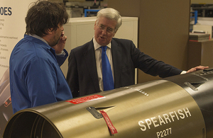Defence Secretary Michael Fallon talking to Andy White, the weapon design authority lead [Picture: David Tucker, Crown copyright]