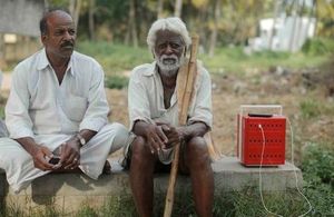 An image of two villagers in rural India with the Buffalo Grid Hub