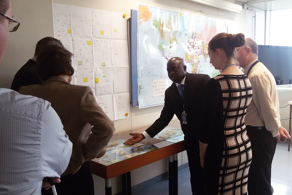 Laboratory Chief, Justice Tettey leads the UK delegation on a tour of the laboratory