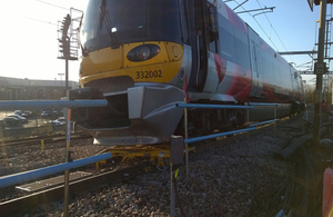 Yellow engineering trolley underneath the train after the collision (image courtesy of Carillion)