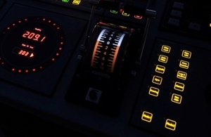 Image of illuminated control panel on the bridge of a ship.
