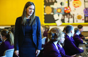 Teacher walking through a classroom