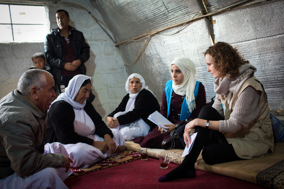 UNHCR protection officer, Gemma Woods, talks to a displaced Iraqi family who are living in a dis-used building on a university campus in northern Iraq. Picture: Andrew McConnell/Panos for DFID