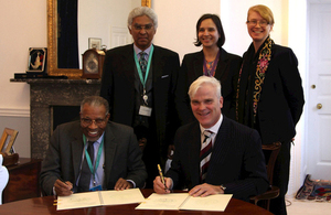 IDP President Dr Ahmad Mohamed Ali Al-Madani and International Development Minister Desmond Swayne sign a Memorandum of Understanding. Picture: DFID