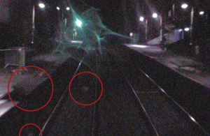 Image of displaced coping stones and debris on track at Moston station