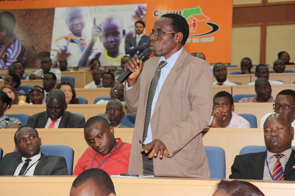 An official from the Government of Uganda asks a question at the event