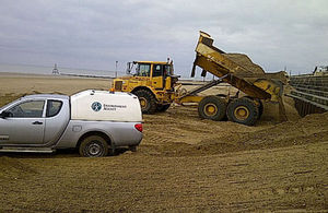 Transporting and tipping sand and shingle