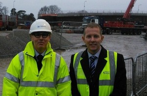 Mark Mosley from the Highways Agency and Wayne Poole from Manchester Airport in front of the new Thorley Lane bridge, ahead of it being lifted into place over the M56 this weekend.