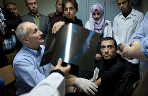 Dr Graeme Groom from King's College Hospital, London, assesses a patient in Gaza's Shifa Hospital. Picture: Abbie Trayler-Smith