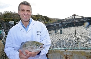 Image of Neil Manchester Managing Director of Landcatch holding a salmon