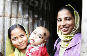 Community health worker Parveen visits a woman and her child in the Korail slum of Dhaka, Bangladesh. Picture: Ricci Coughlan/DFID