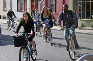 Youths cycling along high street