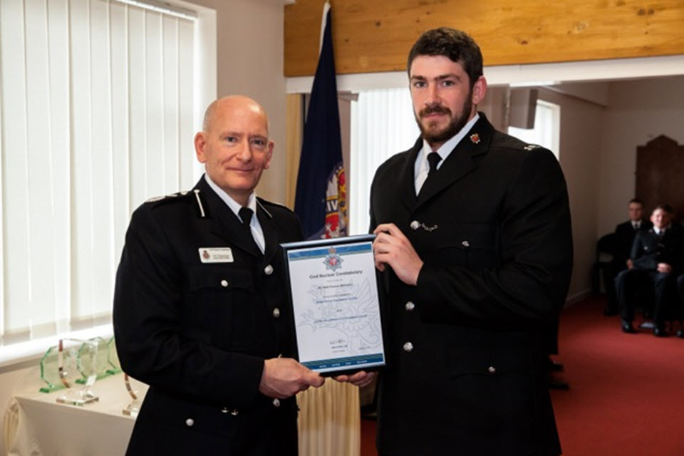 Tom receiving his award from Deputy Chief Constable Chesterman