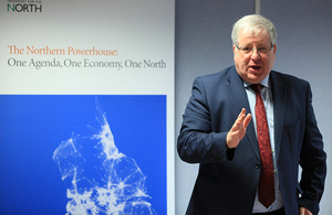 Patrick McLoughlin with the 'Northern transport strategy' sign