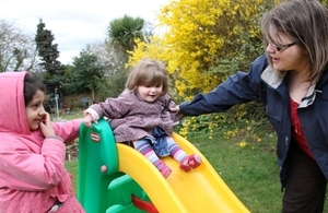 Children on slide with carer