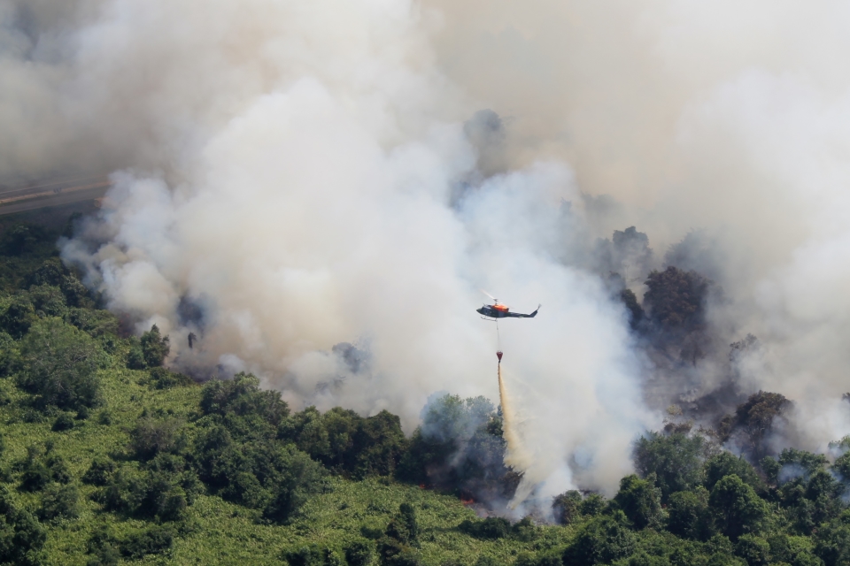 7 Flight Army Air Corps Bell 212 helicopter dispensing 1000 litres of water from an under slung “bambi” bucket