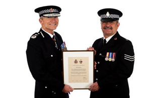 Neill getting his commendation from the Chief