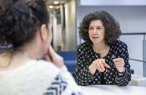 Barbara Domayne-Hayman, of Autifony Therapeutics, talking to female with back to camera