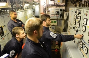 Members of the Marine Engineering department practise switchboard drills onboard HMS Northumberland.