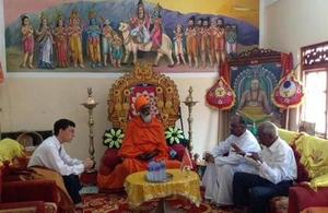 Discussing central role of religious leaders in reconciliation with Hindu chief priest at Nallur Temple.