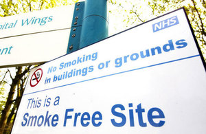 A picture of a 'this is a smoke free sign' on an NHS site