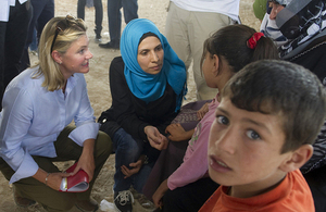 International Development Secretary Justine Greening (left) meeting Syrian refugees in Jordan. Picture: Scott Hornby/Sun