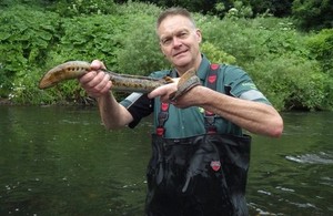 Paul Frear with a sea lamprey