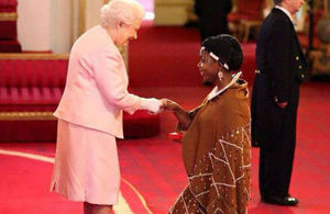 Angel Benedicto receiving her Queen's Young Leaders Award from Her Majesty Queen Elizabeth II