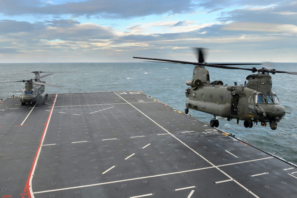 One of the Chinook helicopters takes off from the deck of HMS Bulwark