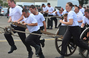 Royal Naval crew members of HMS Portland perform a Field Gun Run (created to commemmorate the relief of Ladysmith) for the pleasure of the 4,000-strong crowd at Leith Docks on Armed Forces Day 2011