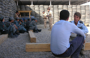 Temporary Inspector Jane Underwood chats with a colleague at the Helmand Police Training Centre