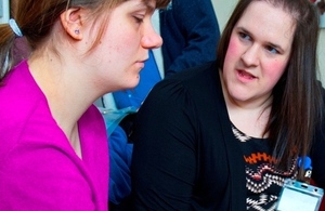 Two women discussing work