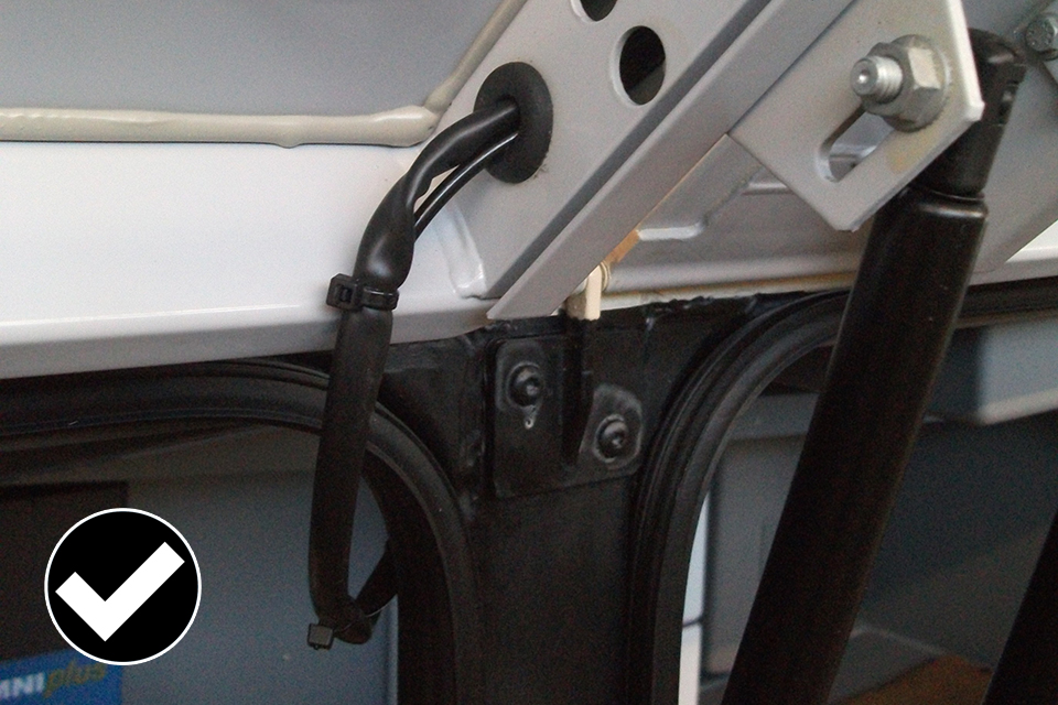 Allowed: good example or wires that have been clipped and fitted in a rubber grommet.