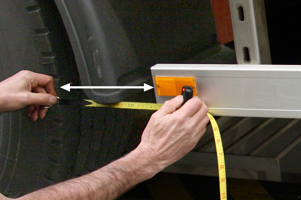 DVSA measure distance from rear of side guard to the first rear axle.