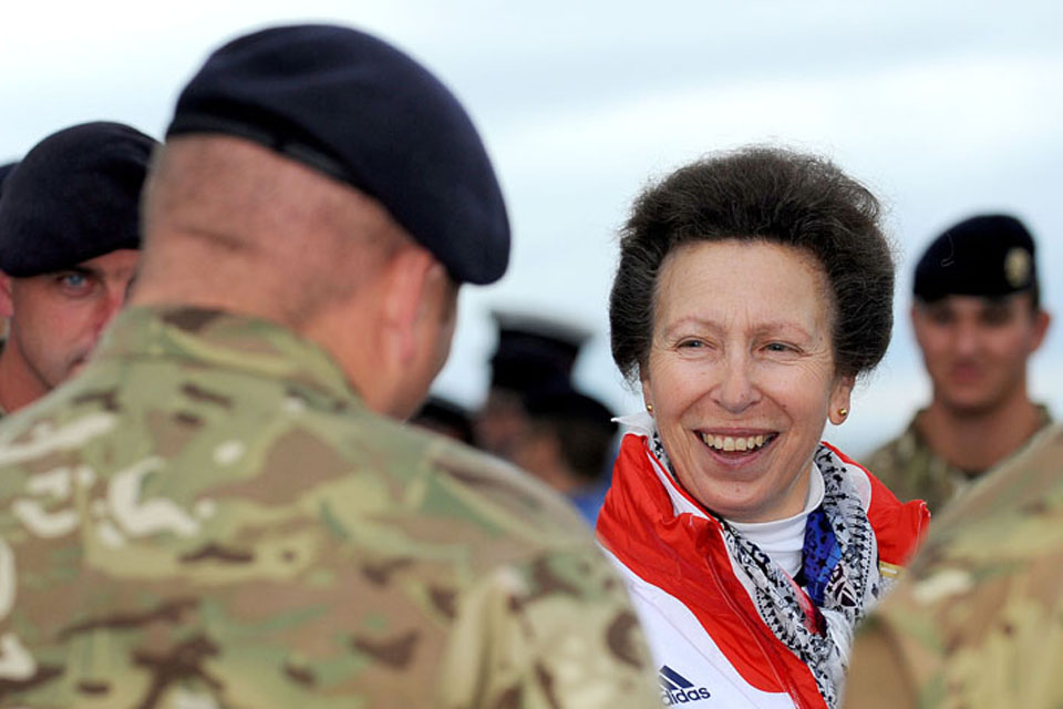 Her Royal Highness Princess Anne shares a joke with a Royal Marine on board Royal Fleet Auxiliary vessel Mounts Bay