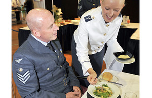 Senior Aircraftwoman Kerri Holmes, from RAF Lossiemouth, competing in the Junior Steward Skills section of Exercise Joint Caterer at Sandown Park Racecourse