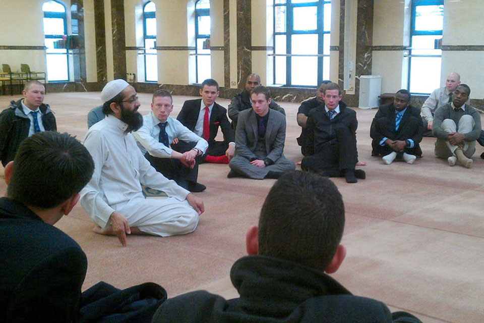 Imam Molana Rashid meets with soldiers from 1st Battalion The Royal Welsh at the Zakaria Mosque in Bolton